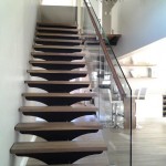 12mm Glass mounted to wood stairs with Standoffs